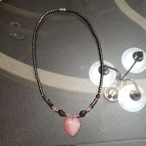I am selling a pink heart quartz pendant necklace.